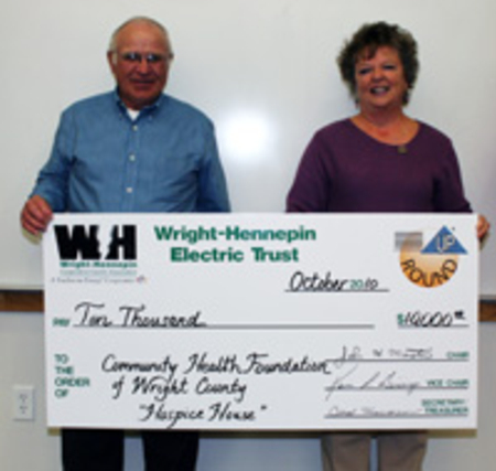 Wright-Hennepin delivering a check for Operation Round Up