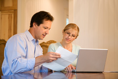 Couple examining their monthly bills