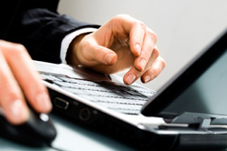 Man registering online for Wright-Hennepin's Group Bill Program