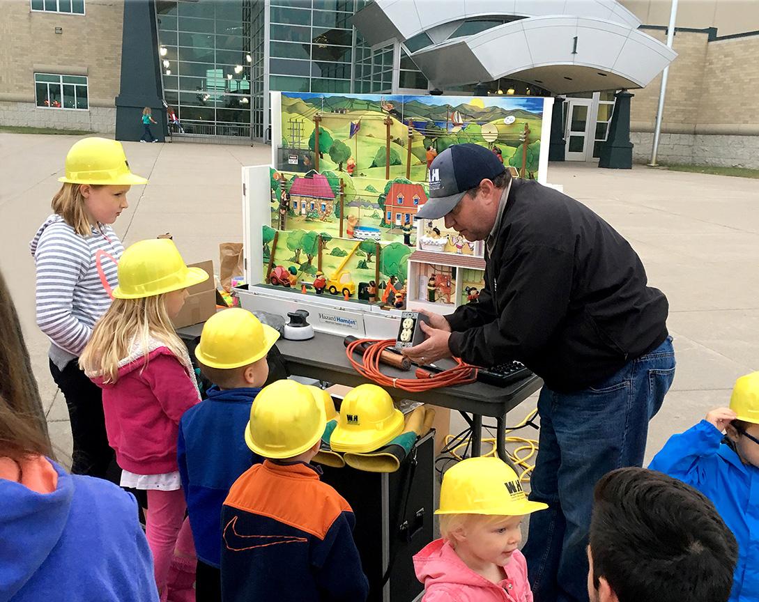 WH employee teaching about electric safety in the community