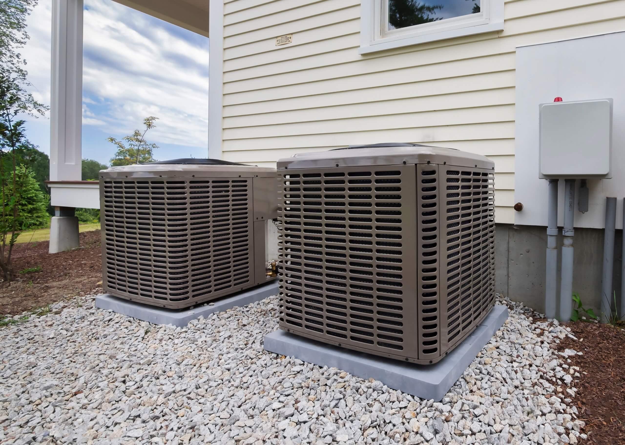 View on two air conditioners beside a home