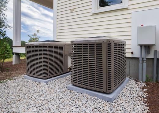View on two air conditioners beside a home