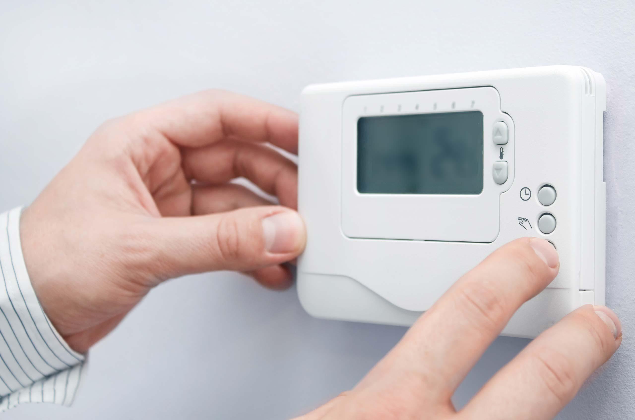 Wright-Hennepin Electric customers adjusts their thermostat