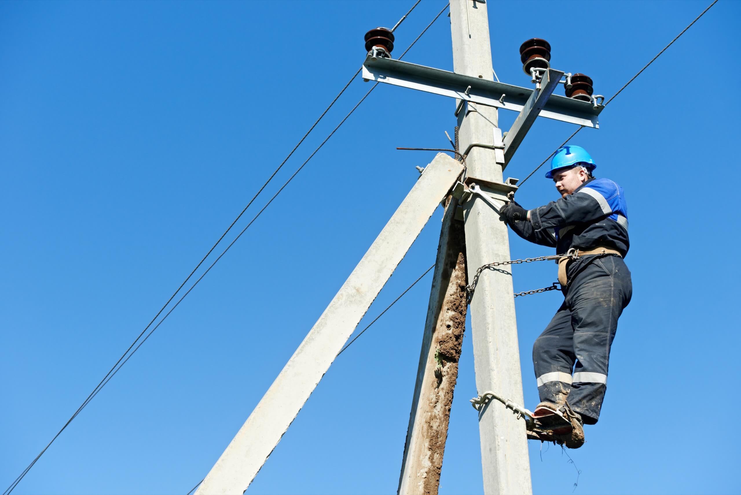 Wright-Hennepin Electric employee safely works on power lines