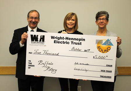 Wright-Hennepin delivering a check for Operation Round Up