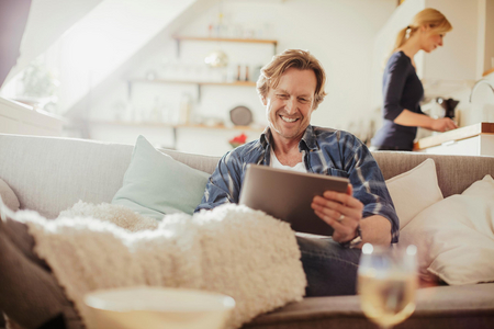 Person on tablet at home