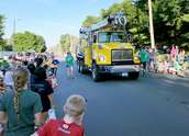 Wright-Hennepin Electric's aerial bucket truck goes through parade