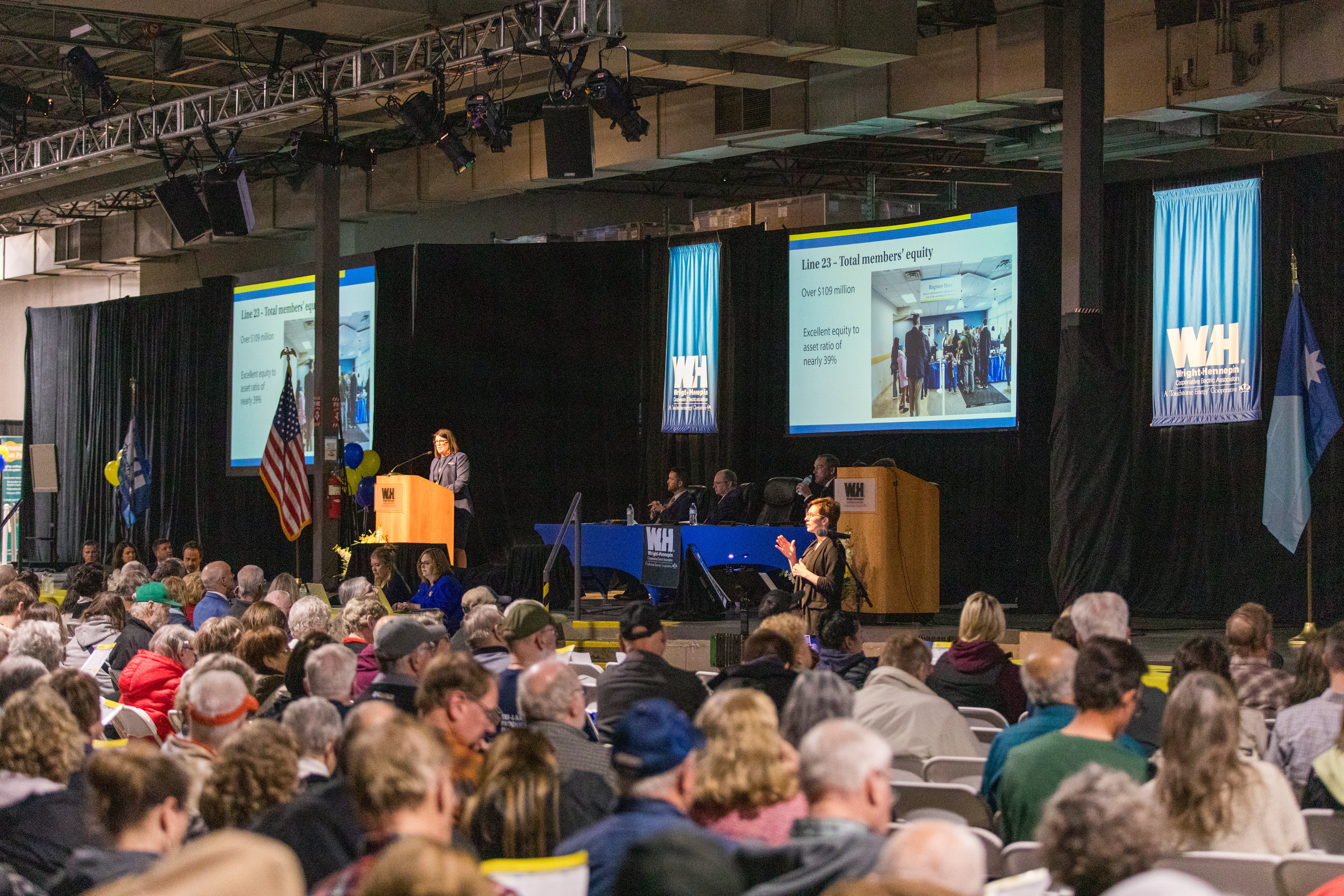 A crowd of people watch a presentation during the 2025 Annual Meeting