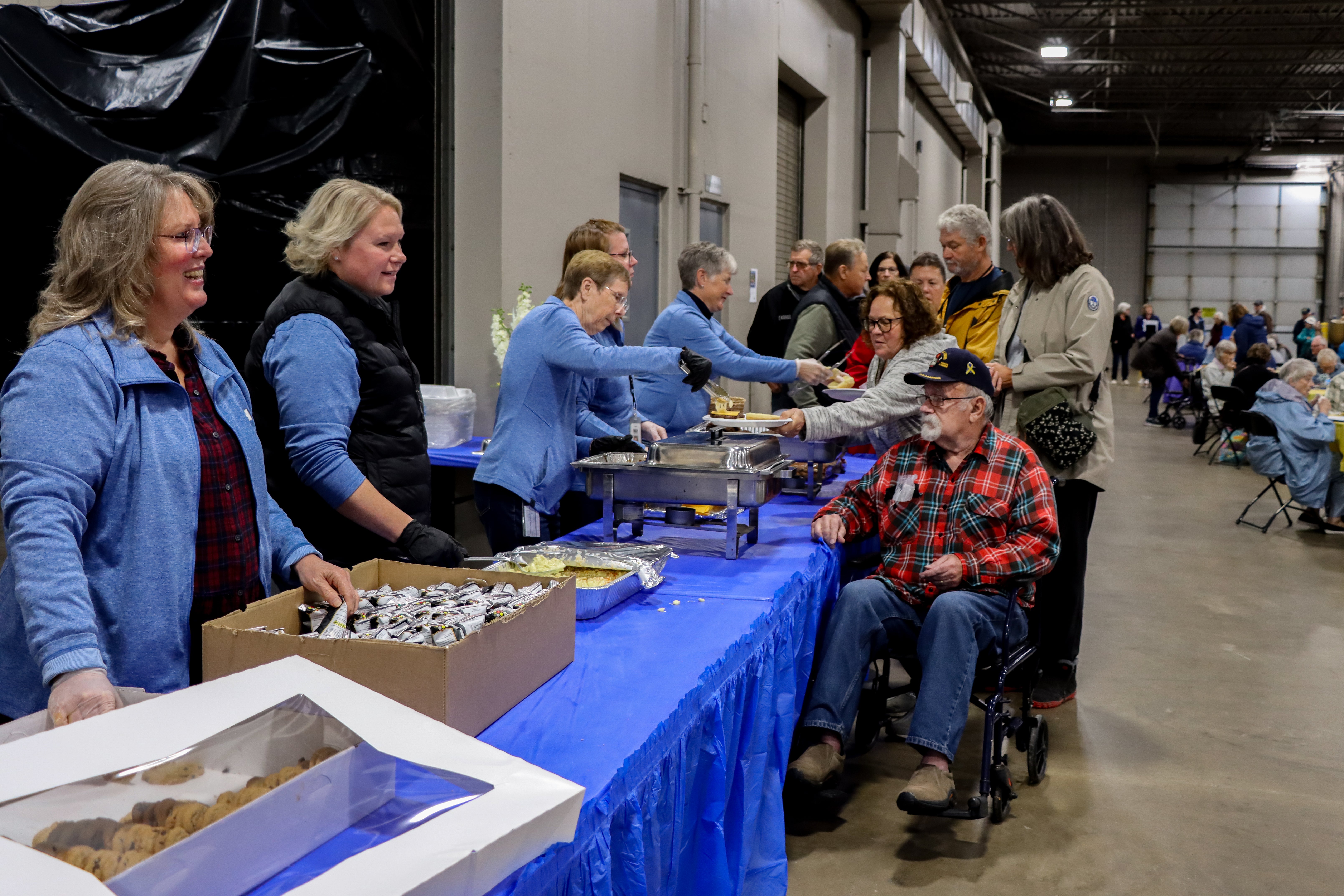 wright hennepin employees serve WH members at the member lunch