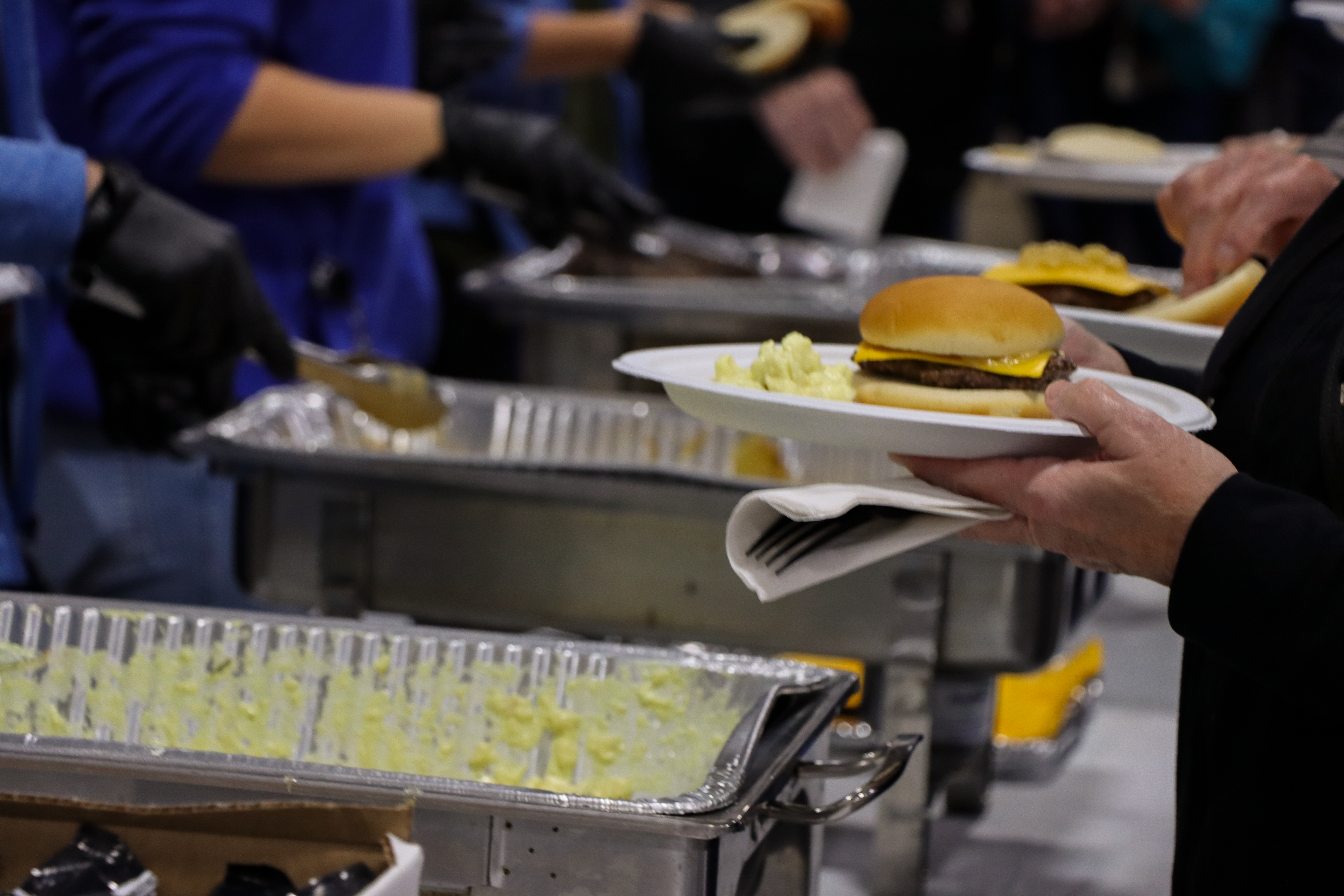 Serving line at the Member Lunch on October 13