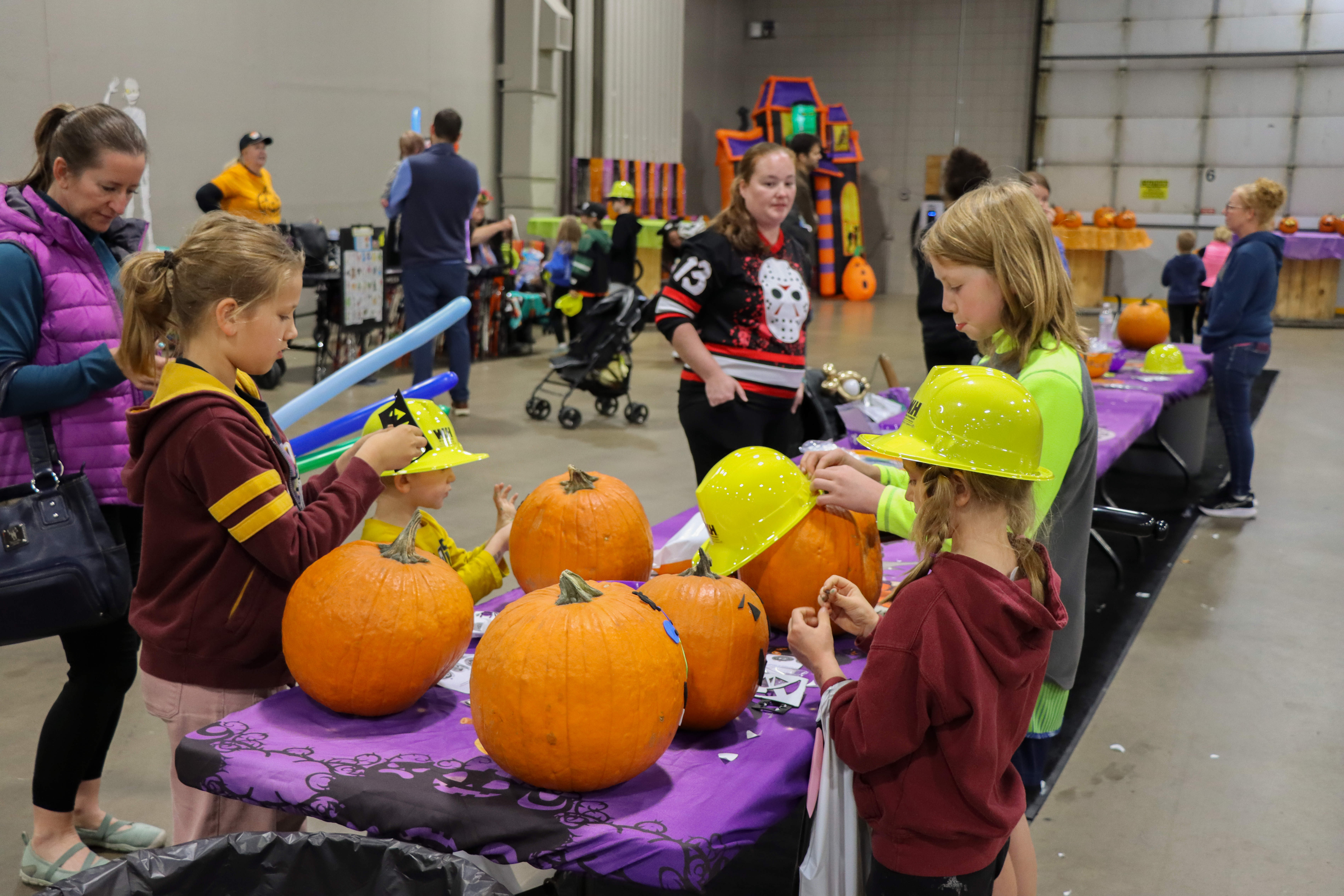 Kids decorate pumpkins at WH’s Fall Festival