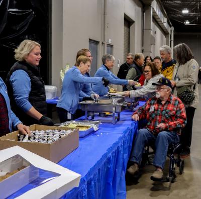 wright hennepin employees serve WH members at the member lunch