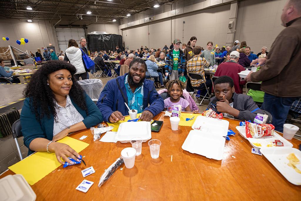 family at table smiling