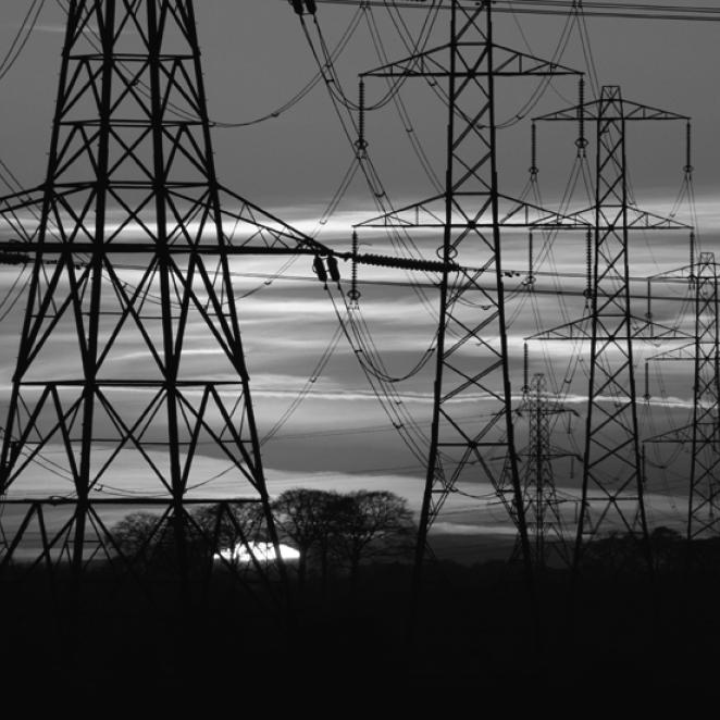 black and white photo of transmission lines